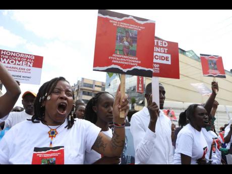 Activists and relatives of Ugandan Olympic athlete Rebecca Cheptegei march calling for an end to femicide in the western city of Eldoret, in Rift Valley, Kenya yesterday.