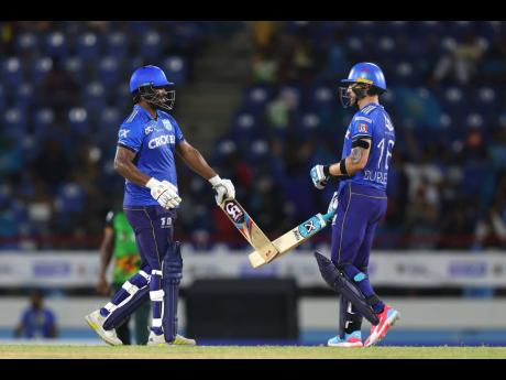 Faf du Plessis (right) and teammate Johnson Charles of St Lucia Kings bring up their 100 partnership during the Men’s 2024 Republic Bank Caribbean Premier League match between St Lucia Kings and Saint Kitts & Nevis Patriots at Daren Sammy National Cricke