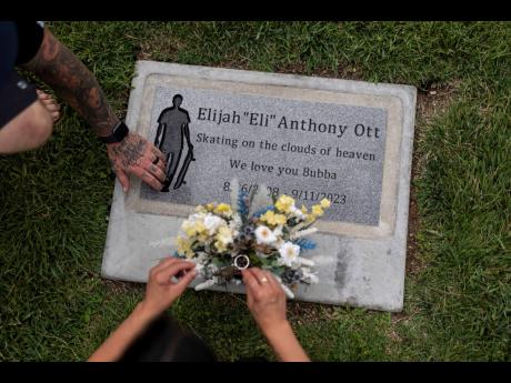 Mikayla Brown and her husband, Tyler, visit the grave of their son, Elijah, who died of a fentanyl overdose at 15, in Paso Robles, California.