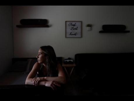 Mikayla Brown sits for a photo in the room of her son, Elijah, who died of a fentanyl overdose at 15, in Atascadero, California.