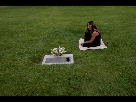 AP PHOTOS
Mikayla Brown visits the grave of her son, Elijah, who died of a fentanyl overdose at 15, in Paso Robles, California.