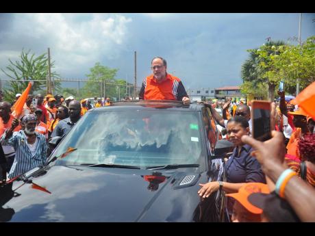 People’s National Party President Mark Golding arriving at the National Arena for the public session of the party’s 85th annual conference last September.