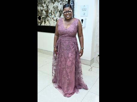 Georgia Morrison, assistant vice president of sales at CUNA Caribbean Insurance, complements her specs well with a lace mauve gown.