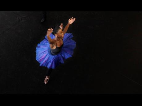 In this Tuesday, July 10, 2012 photo, dancer Michaela DePrince rehearses for her lead role in Le Corsaire in Johannesburg. 