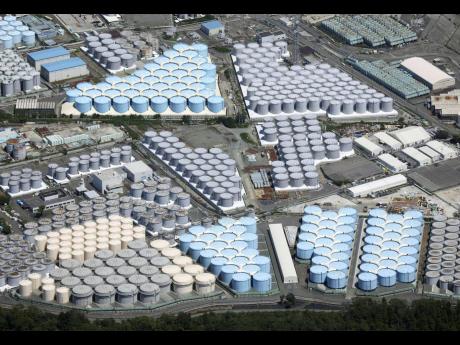 This aerial view shows the tanks which contain treated radioactive wastewater at the Fukushima Daiichi nuclear power plant in Fukushima, northern Japan.