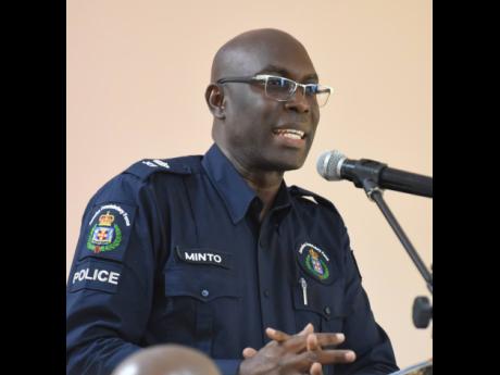 Superintendent of Police Coleridge Minto, head of the St Elizabeth police, making a report during last Thursday’s sitting of the St Elizabeth Municipal Corporation. 