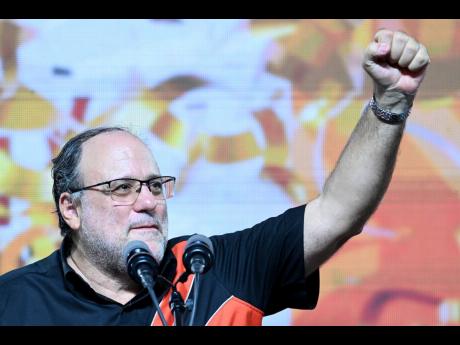 PNP President Mark Golding (left) at the party’s 86th annual conference.