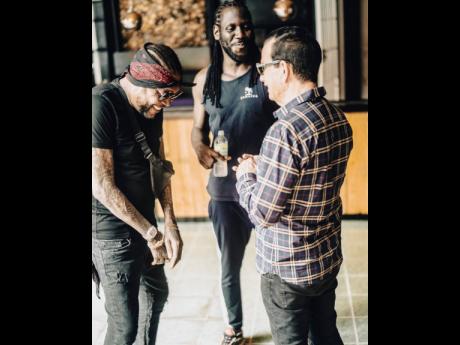 From left, Vybz Kartel shares a laugh with Skatta Burrell and Joe Bogdanovich of Downsound Entertainment, the producers of the Freedom Street concert to be held at the National Stadium in Kingston on New Year’s Eve.