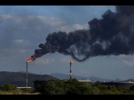 Gas is flared at the Jose Antonio Anzoategui oil complex in Barcelona, Anzoategui State, Venezuela, on January 9, 2024.