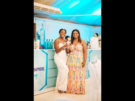 Dr Neveta Sutherland Vaccianna (left) and Dr Astrid Batchelor share smiles and cocktails.