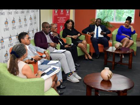 From left: Dionne Jackson Miller, attorney-at-law and moderator; Reginald Budhan, former permanent secretary in the Ministry of Industry, Investment and Commerce; Dr Loxley Christie, of the Hugh Wynter Institute for Reproductive Healthcare and Endoscopic S