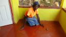 Seventy-eight-year-old Miss Kitsy still cleans her floor with a coconut brush.