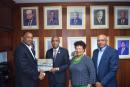 President of the Caribbean Maritime University (CMU) Professor Andrew Spencer (second from left) is presented with a copy of ‘History of the Shipping Association of Jamaica, 1939-2005: Jamaica’s premier maritime institution’ from Shipping Association