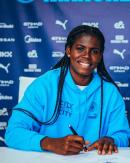 Reggae Girlz’ and Mancheter City’s Khadija Shaw puts pen to paper on a new contract.