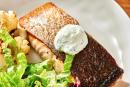 Crispy skinned salmon with dill sauce, paired with roasted cauliflower and a simple green lettuce salad.