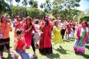 Persons playing Holi, Hindu festival of colours ushering in Spring, at India-Jamaica Friendship Garden.