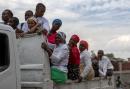 People commute on the back of a truck after attending a church service in the Petion-Ville neighborhood of Port-au-Prince, Haiti.