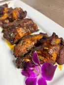Chef Grubb is inviting you to try her oxtail wings.